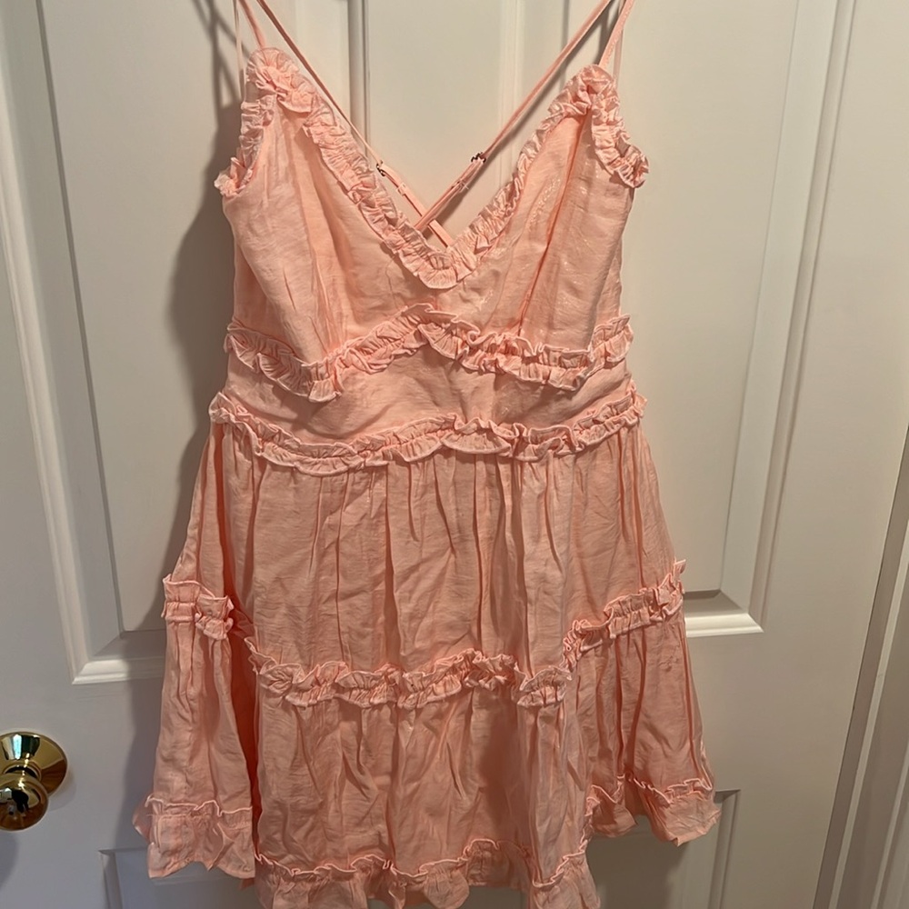 Light pink sleeveless ruffle dress